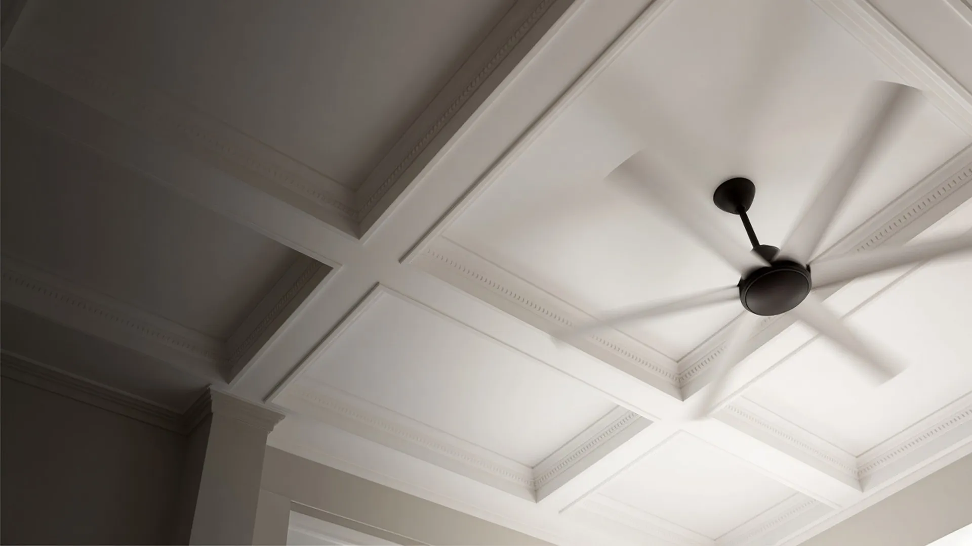 A ceiling fan seen from directly below
